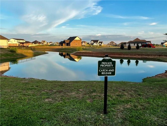 Pond and Waterfront at Windstone neighborhood in Norman