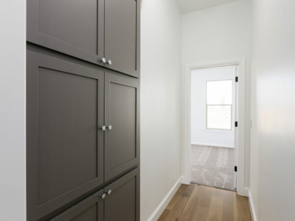 hallway, linen closet, storage, wood floors, hallway storage, cabinetry, interior design, new construction, interior design, home for sale, homes in Norman, Norman OK