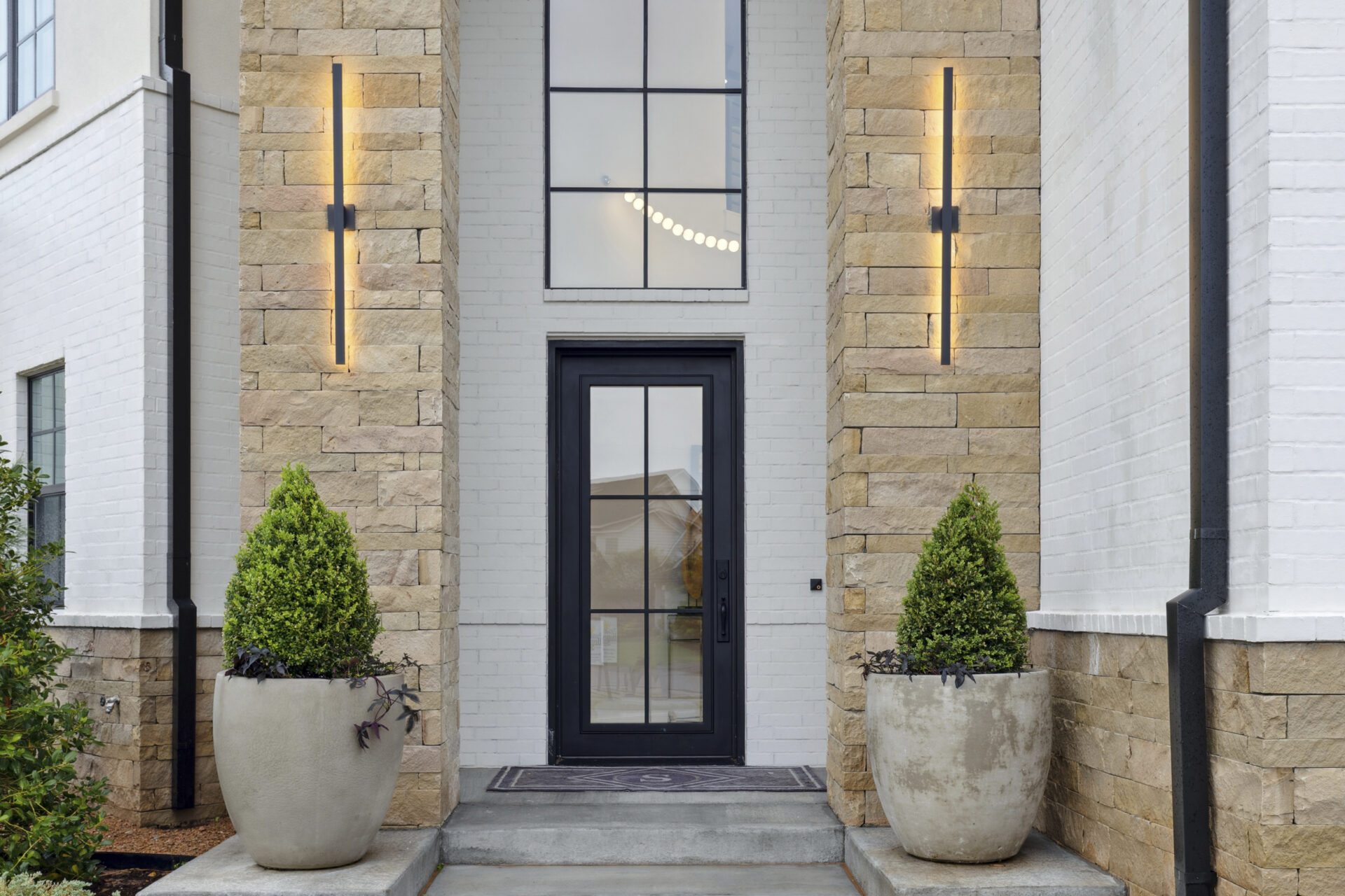 luxury entry, iron door, outdoor lighting