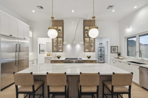 luxury kitchen, large island, pendant lights, hood vent